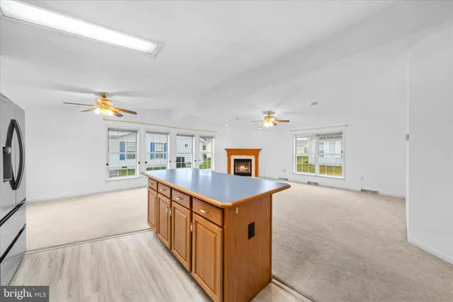 a kitchen with granite countertop a sink and a stove top oven