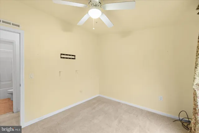 a view of a chandelier fan in a room