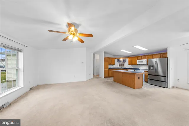 a view of kitchen with furniture and a window