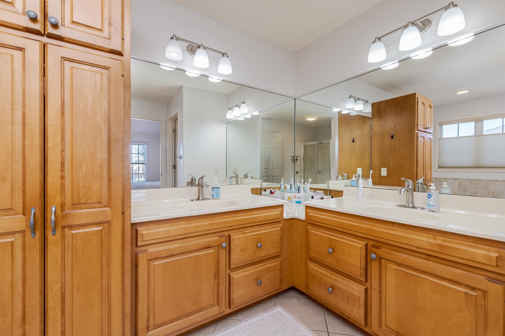 1223 Joy Walk Way Normal, IL 61761 - Photo 22 of 48 a bathroom with a double vanity sink and a mirror