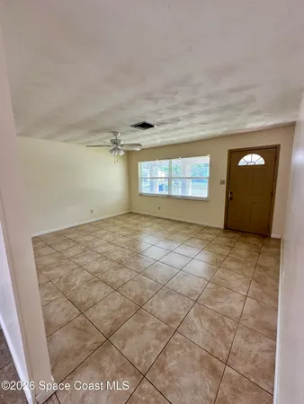 a kitchen with a refrigerator and a stove top oven