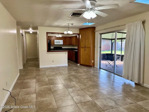 a kitchen with a refrigerator a stove and cabinets