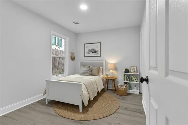 a bed room with a bed and a window