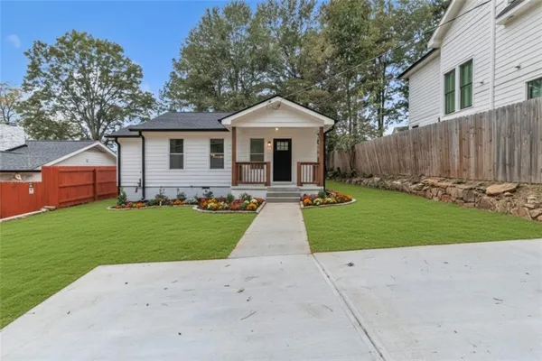 a front view of house with yard and green space