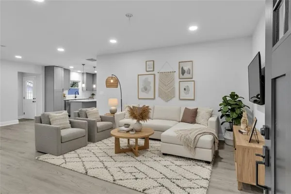 a living room with furniture and a large window