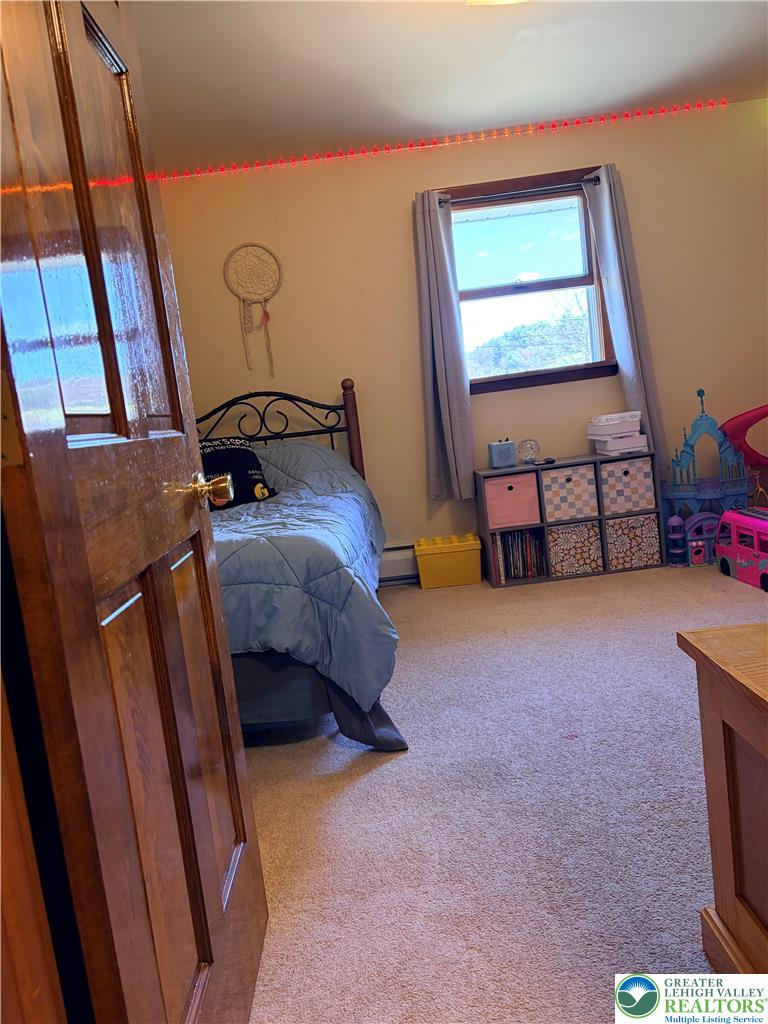 100 Hazelwood Road Lehighton, PA 18235 - Photo 29 of 31 a bedroom with a bed and a window