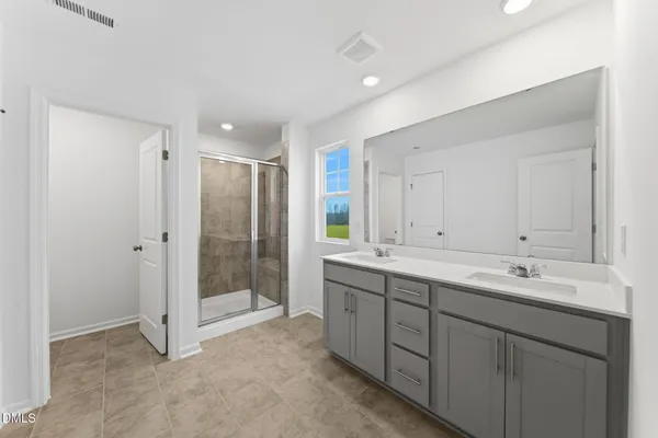 a view of bathroom with dual sinks
