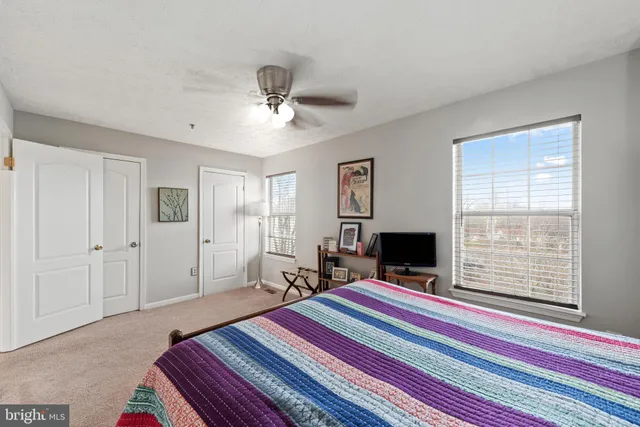 a bathroom with a toilet a sink and a mirror