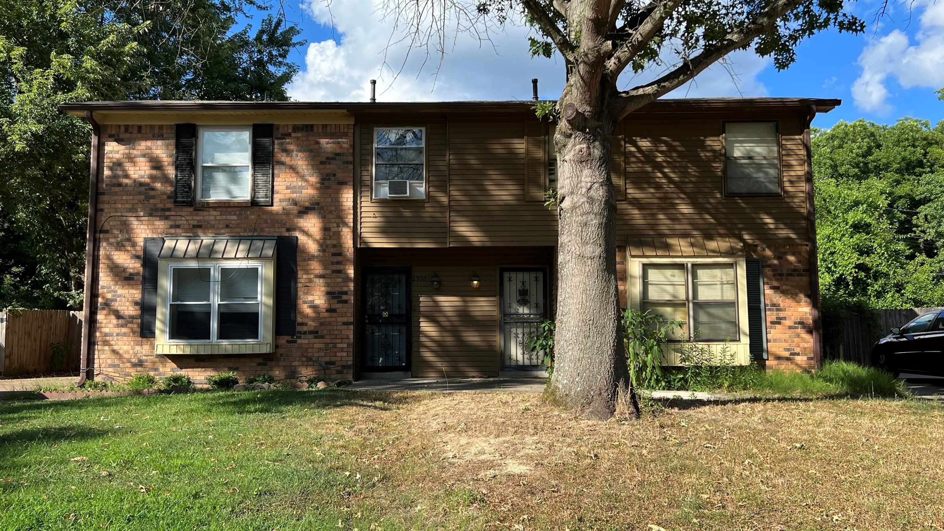 front view of a house with a yard