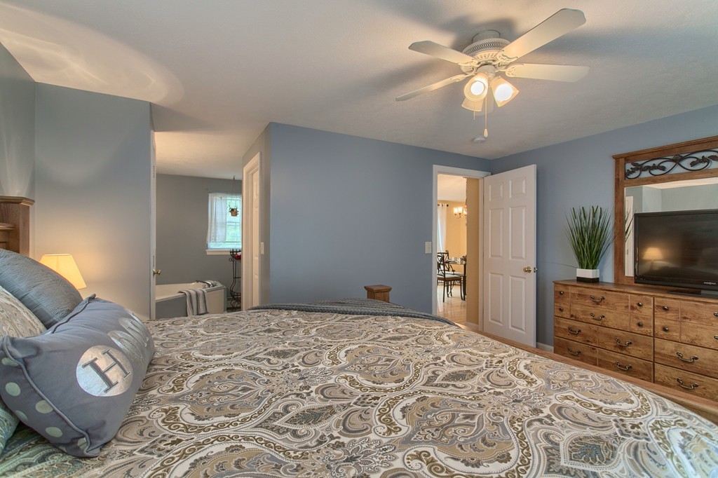 623 New Ipswich Road Ashby, MA 01431 - Photo 12 of 23 a bedroom with a bed and a flat screen tv