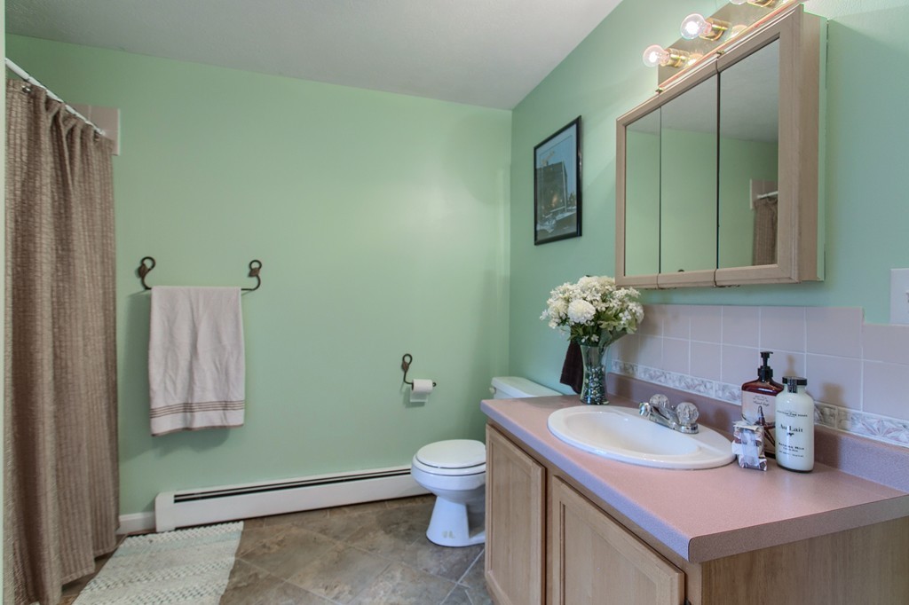 623 New Ipswich Road Ashby, MA 01431 - Photo 17 of 23 a bathroom with a toilet sink and mirror