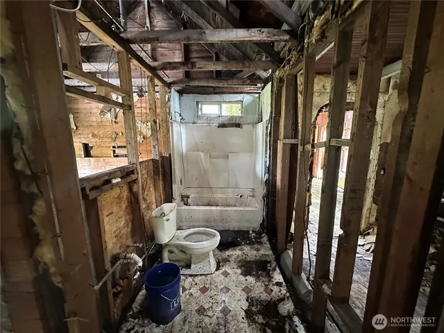 a bathroom with a toilet a sink and a shower