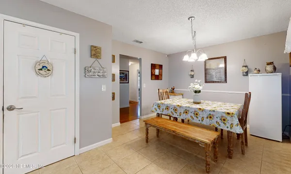 a spacious bedroom with a bed and a table