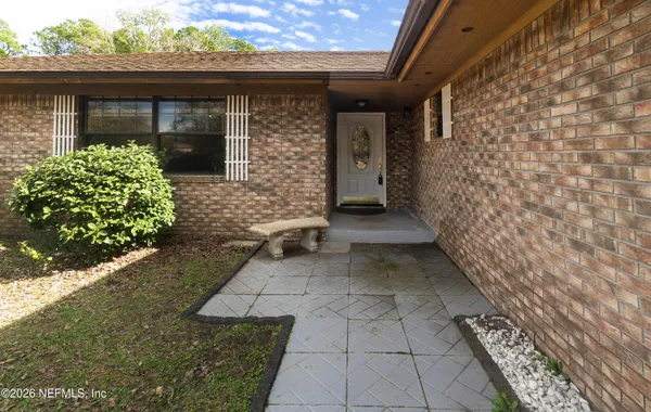 a backyard of a house with lots of green space