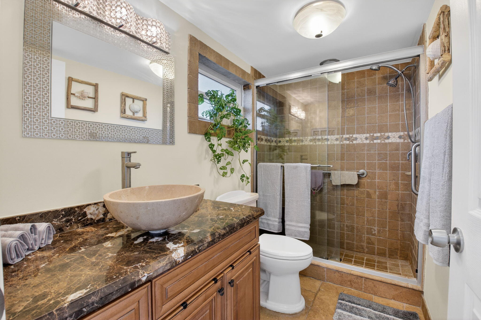 711 Northeast Harbour Terrace, Unit 3120 Boca Raton, FL 33431 - Photo 11 of 46 a bathroom with a granite countertop sink a toilet and shower