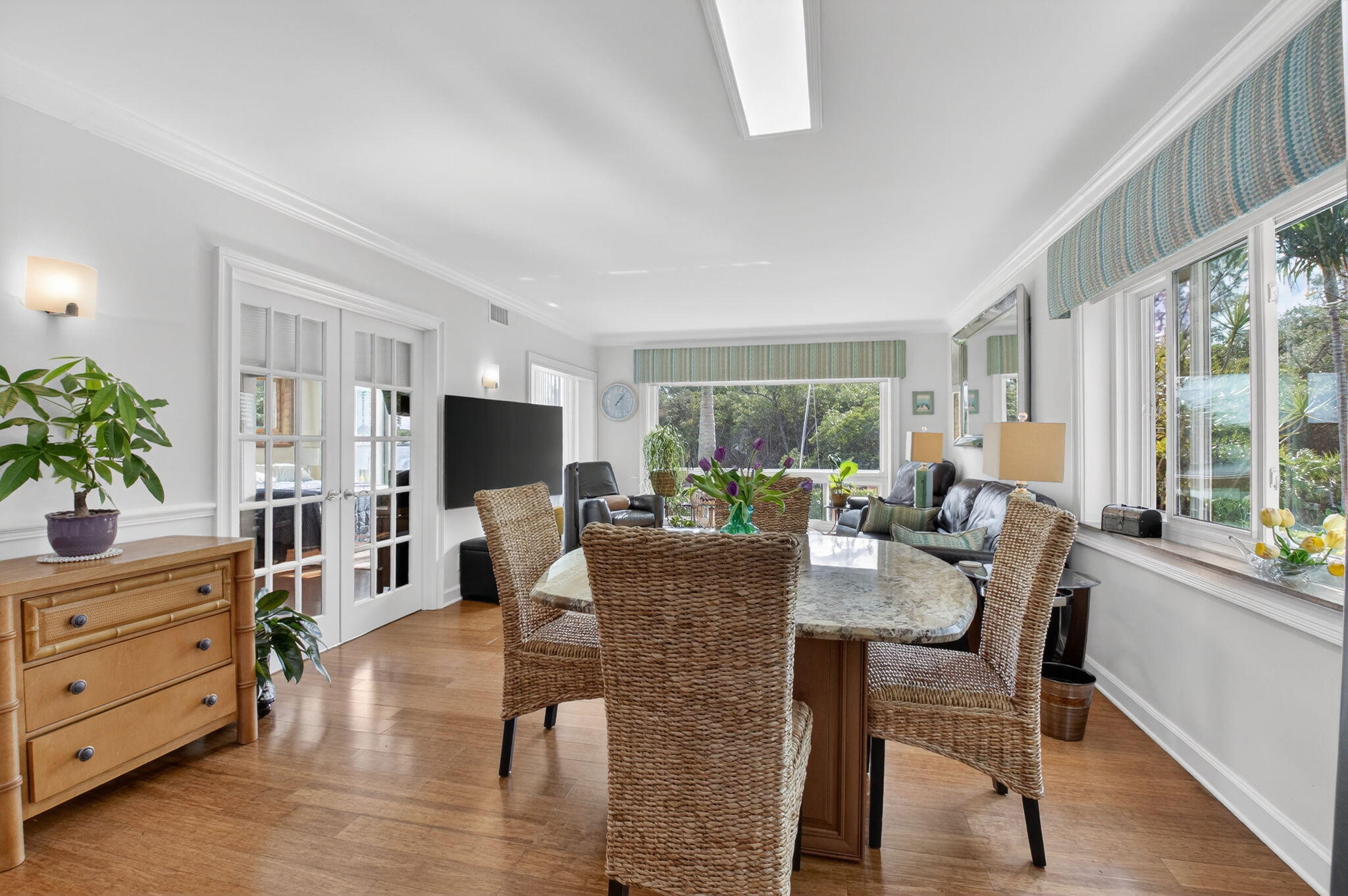 711 Northeast Harbour Terrace, Unit 3120 Boca Raton, FL 33431 - Photo 12 of 46 a view of a dining room with furniture window and wooden floor