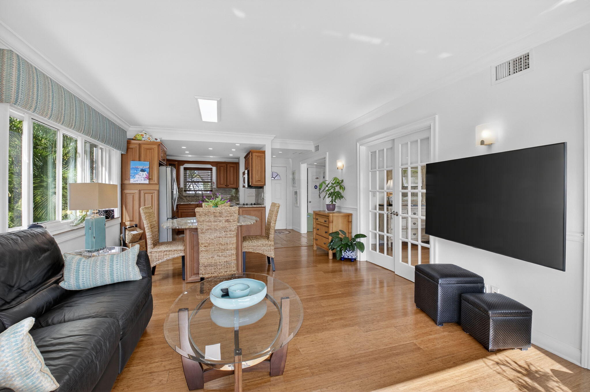 711 Northeast Harbour Terrace, Unit 3120 Boca Raton, FL 33431 - Photo 16 of 46 a living room with furniture and a flat screen tv