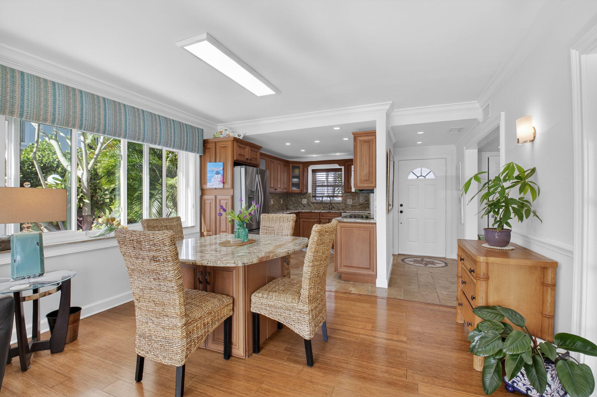 711 Northeast Harbour Terrace, Unit 3120 Boca Raton, FL 33431 - Photo 20 of 46 a view of a dining room with furniture window and wooden floor