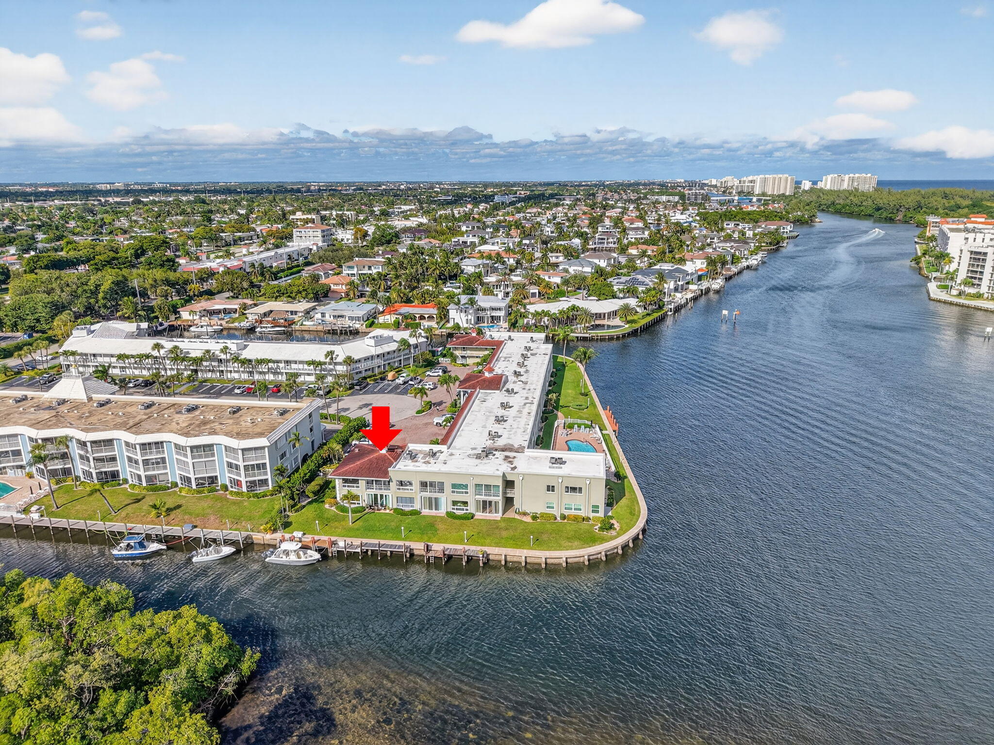 711 Northeast Harbour Terrace, Unit 3120 Boca Raton, FL 33431 - Photo 2 of 46 a view of a swimming pool and an outdoor seating