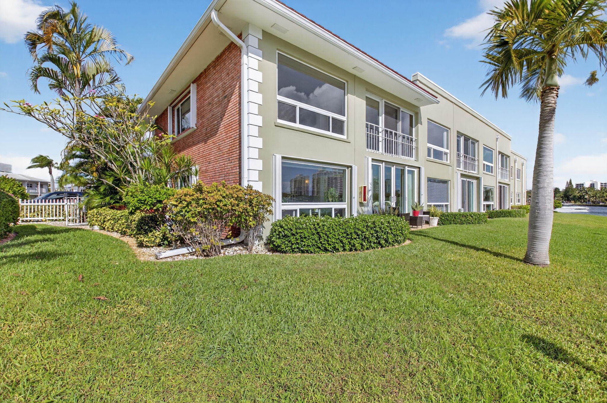 711 Northeast Harbour Terrace, Unit 3120 Boca Raton, FL 33431 - Photo 39 of 46 a view of a building with a yard