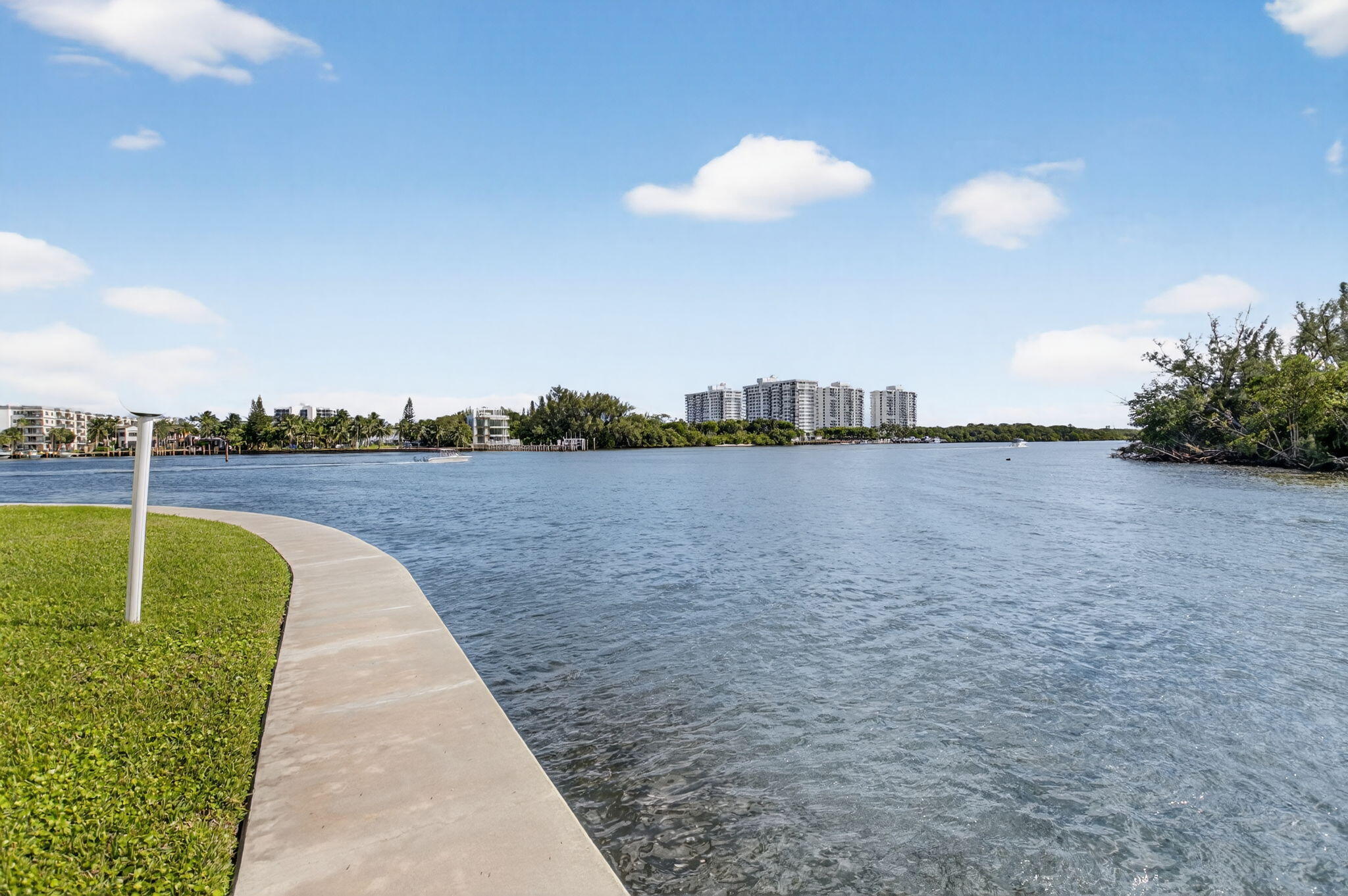711 Northeast Harbour Terrace, Unit 3120 Boca Raton, FL 33431 - Photo 40 of 46 a view of a lake with a big yard