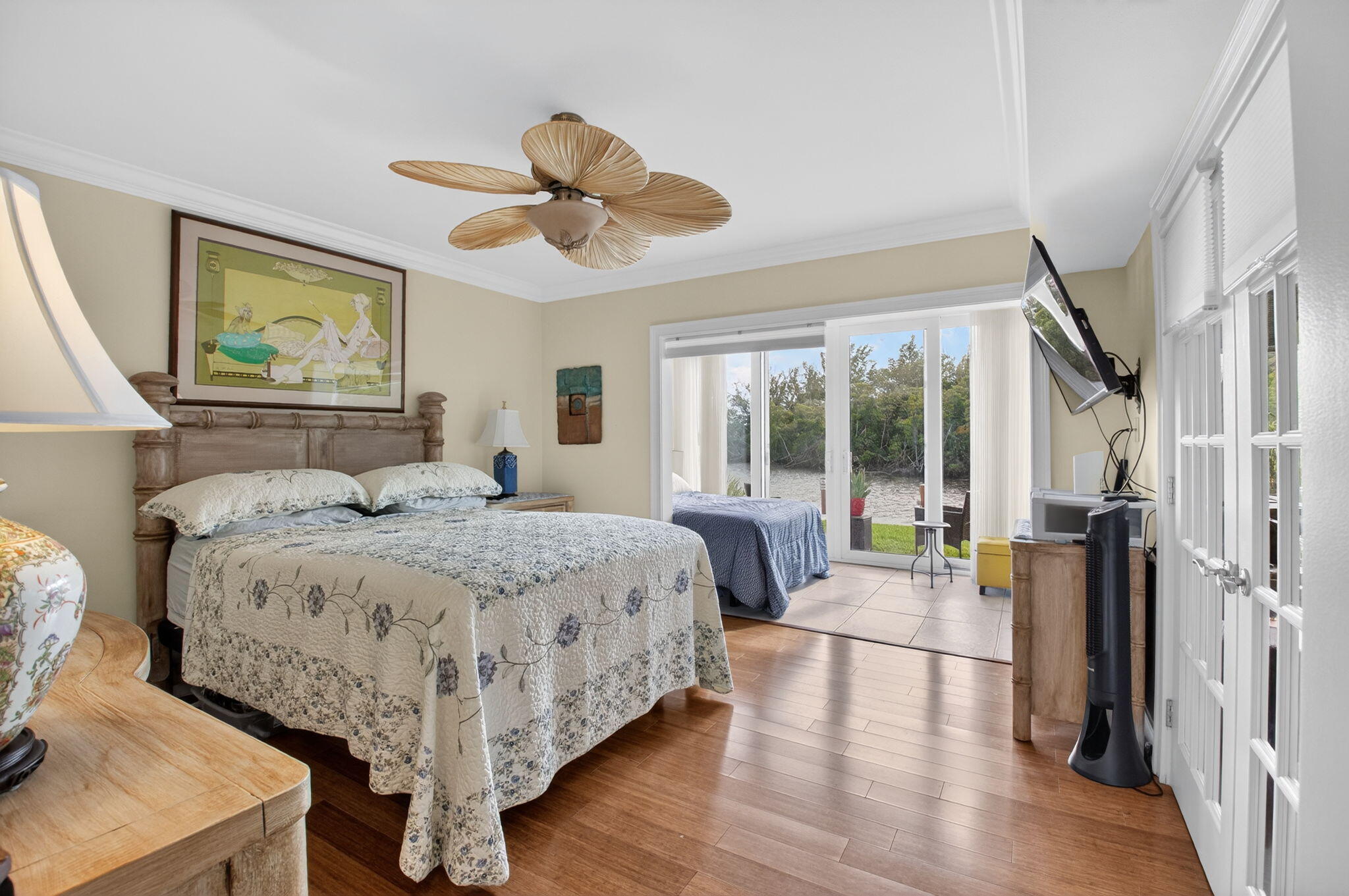 711 Northeast Harbour Terrace, Unit 3120 Boca Raton, FL 33431 - Photo 7 of 46 a bedroom with a large bed and a large window