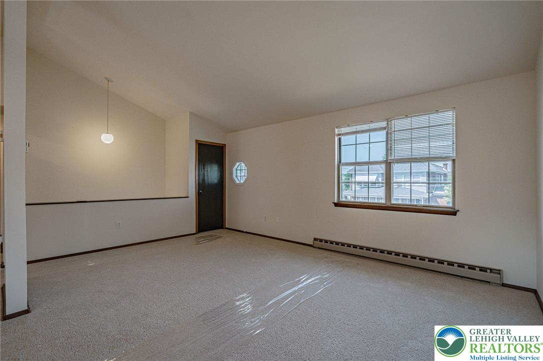 25 North 8th Street Emmaus, PA 18049 - Photo 23 of 51 A versatile living space offering ample natural light and clean carpeting.