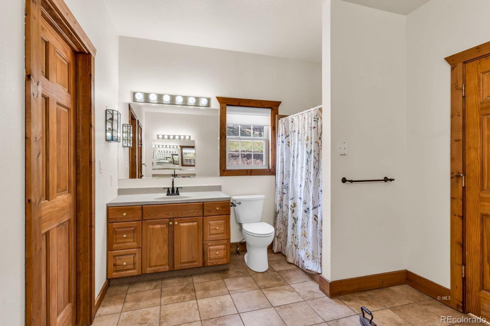 220 Rhonda Road Westcliffe, CO 81252 - Photo 13 of 35 a bathroom with a toilet sink and mirror