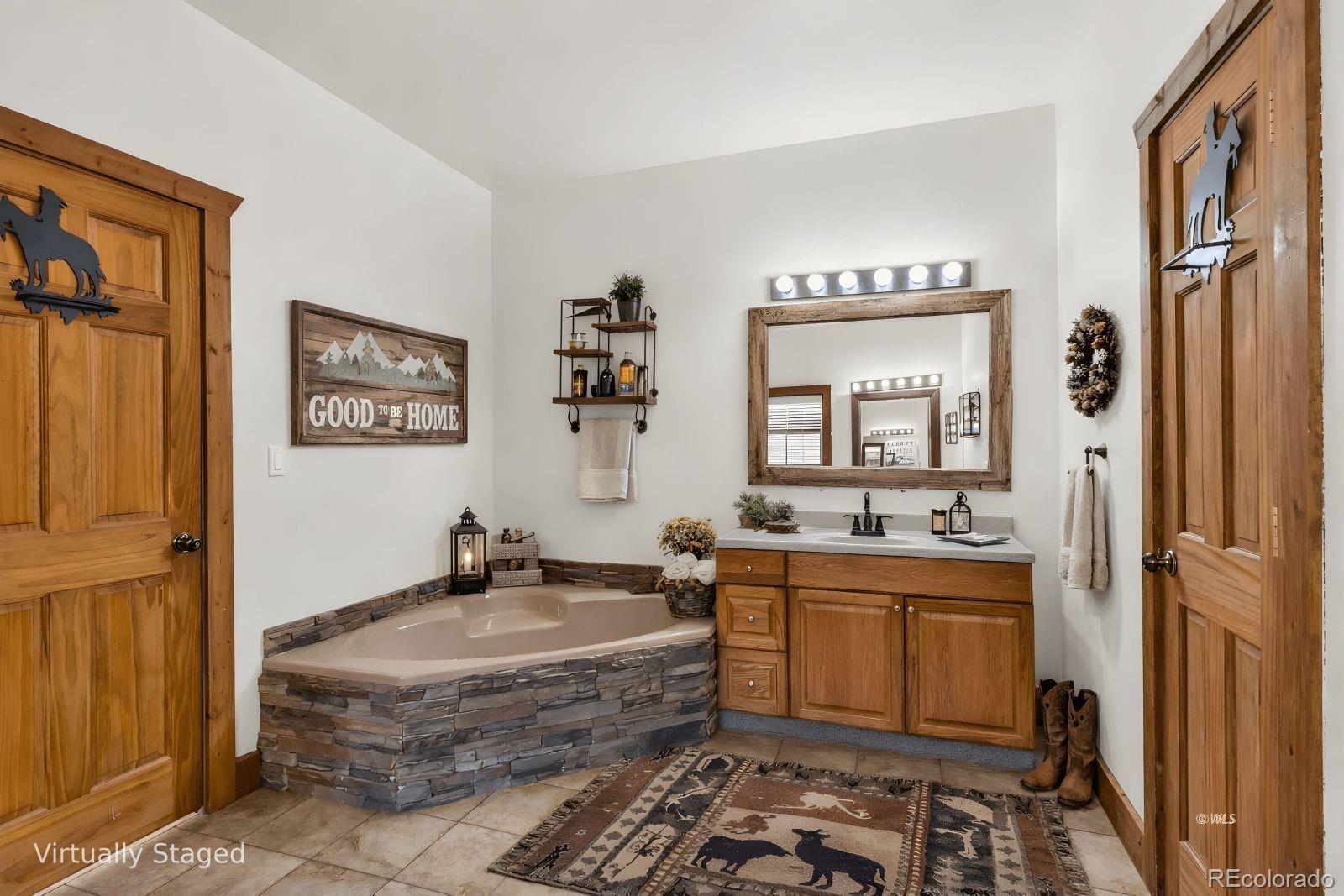220 Rhonda Road Westcliffe, CO 81252 - Photo 16 of 35 a bathroom with a granite countertop sink and a mirror