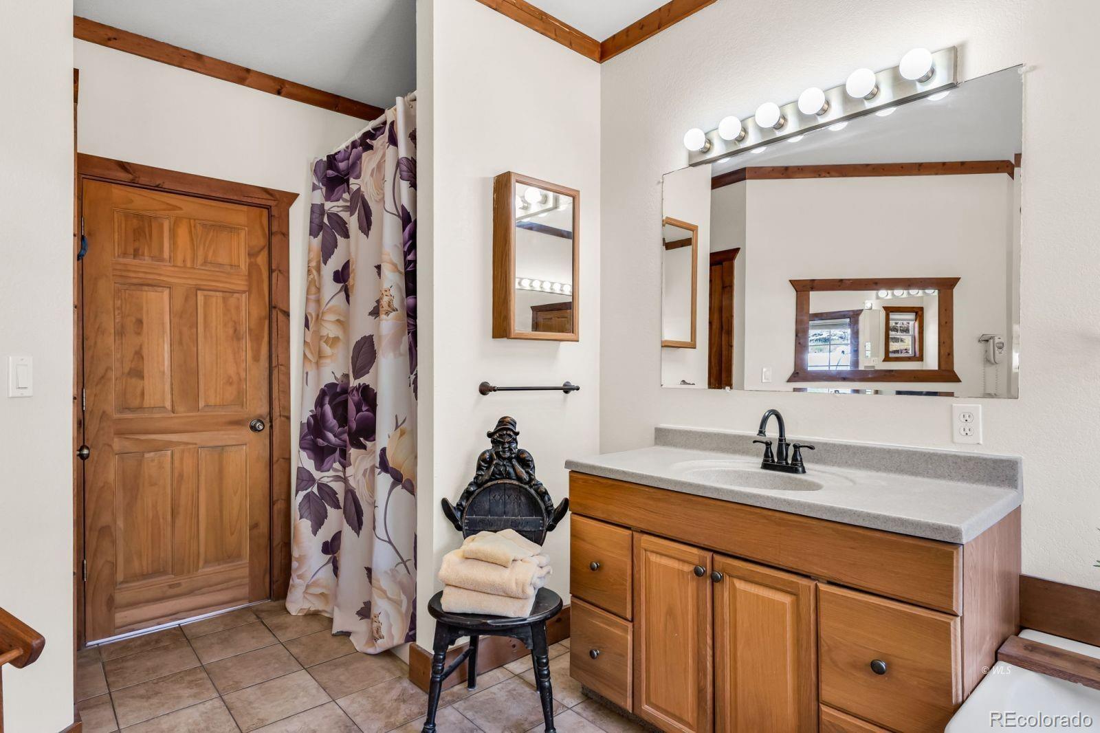 220 Rhonda Road Westcliffe, CO 81252 - Photo 19 of 35 a bathroom with a sink and a mirror