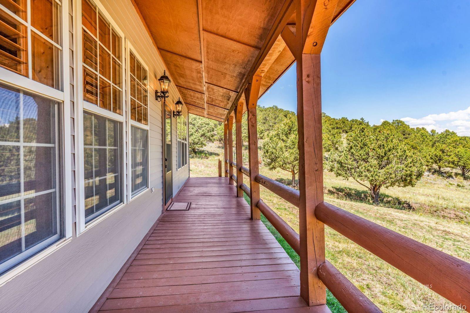 220 Rhonda Road Westcliffe, CO 81252 - Photo 2 of 35 a view of balcony with wooden floor
