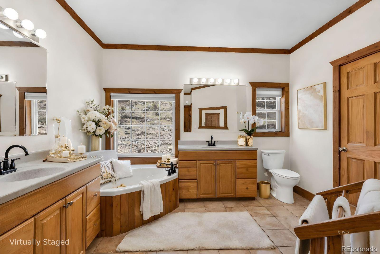 220 Rhonda Road Westcliffe, CO 81252 - Photo 21 of 35 a large bathroom with a double vanity sink a mirror and a toilet
