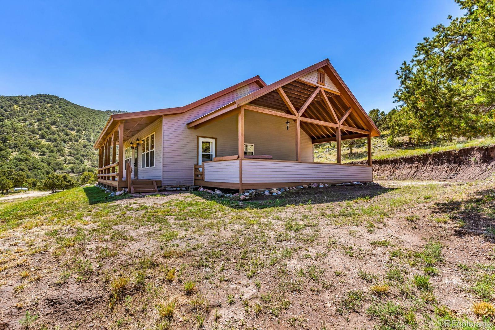 220 Rhonda Road Westcliffe, CO 81252 - Photo 24 of 35 a front view of a house with a yard