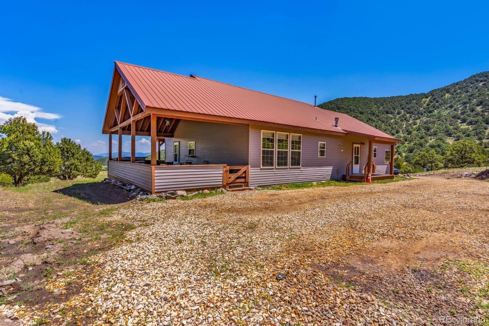 220 Rhonda Road Westcliffe, CO 81252 - Photo 25 of 35 front view of a house with a yard