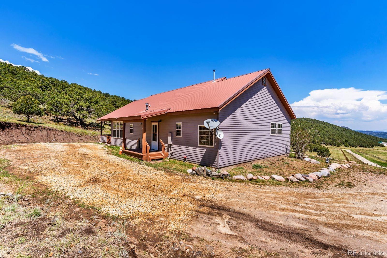220 Rhonda Road Westcliffe, CO 81252 - Photo 27 of 35 a view of a house with wooden fence