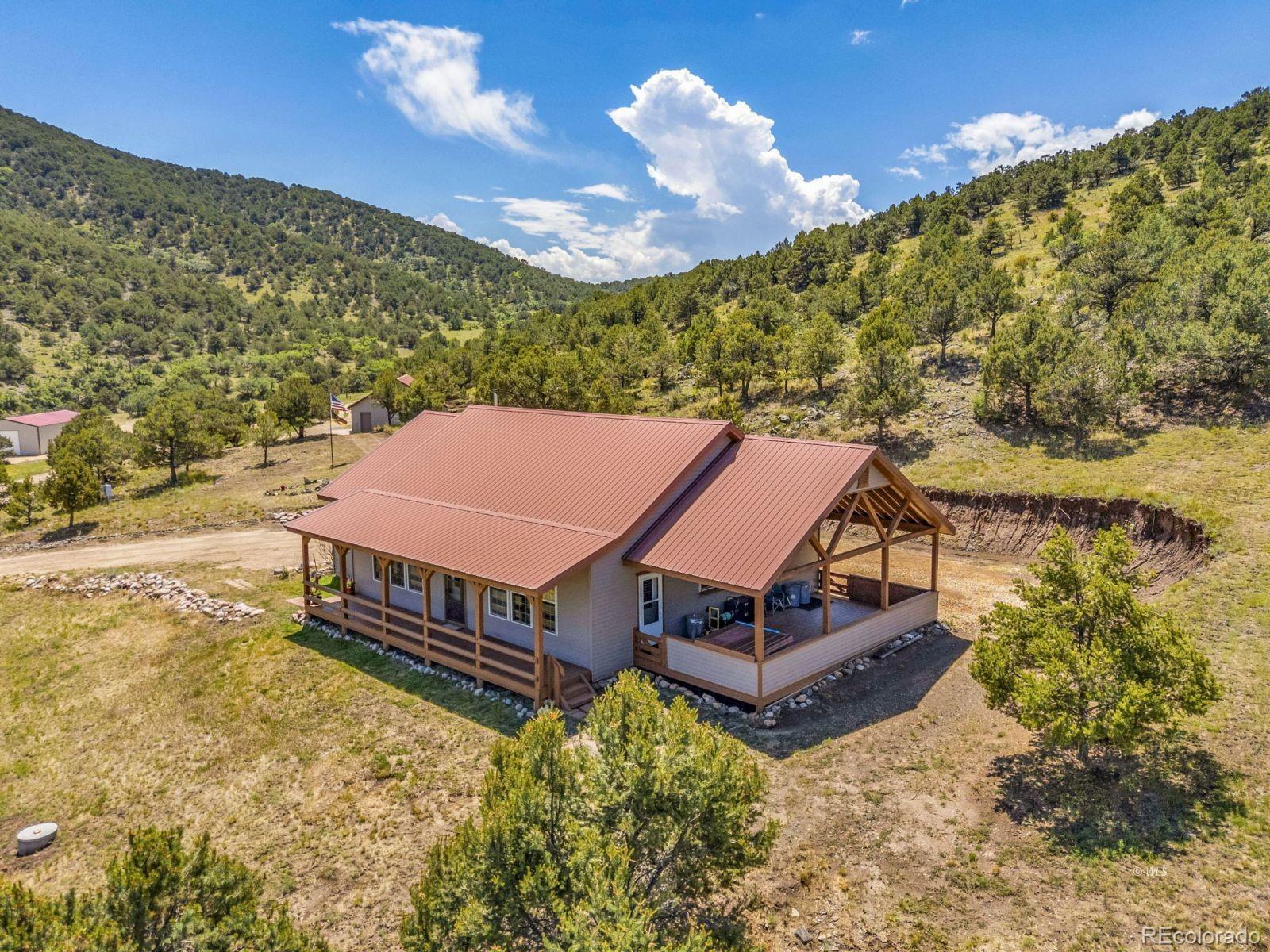 220 Rhonda Road Westcliffe, CO 81252 - Photo 29 of 35 a wooden fence with some trees in the background