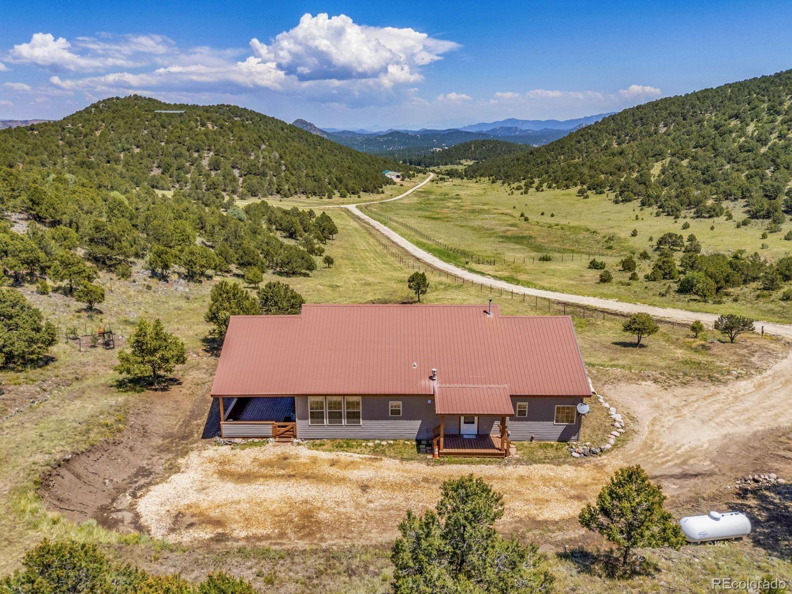220 Rhonda Road Westcliffe, CO 81252 - Photo 30 of 35 a view of a house with a yard