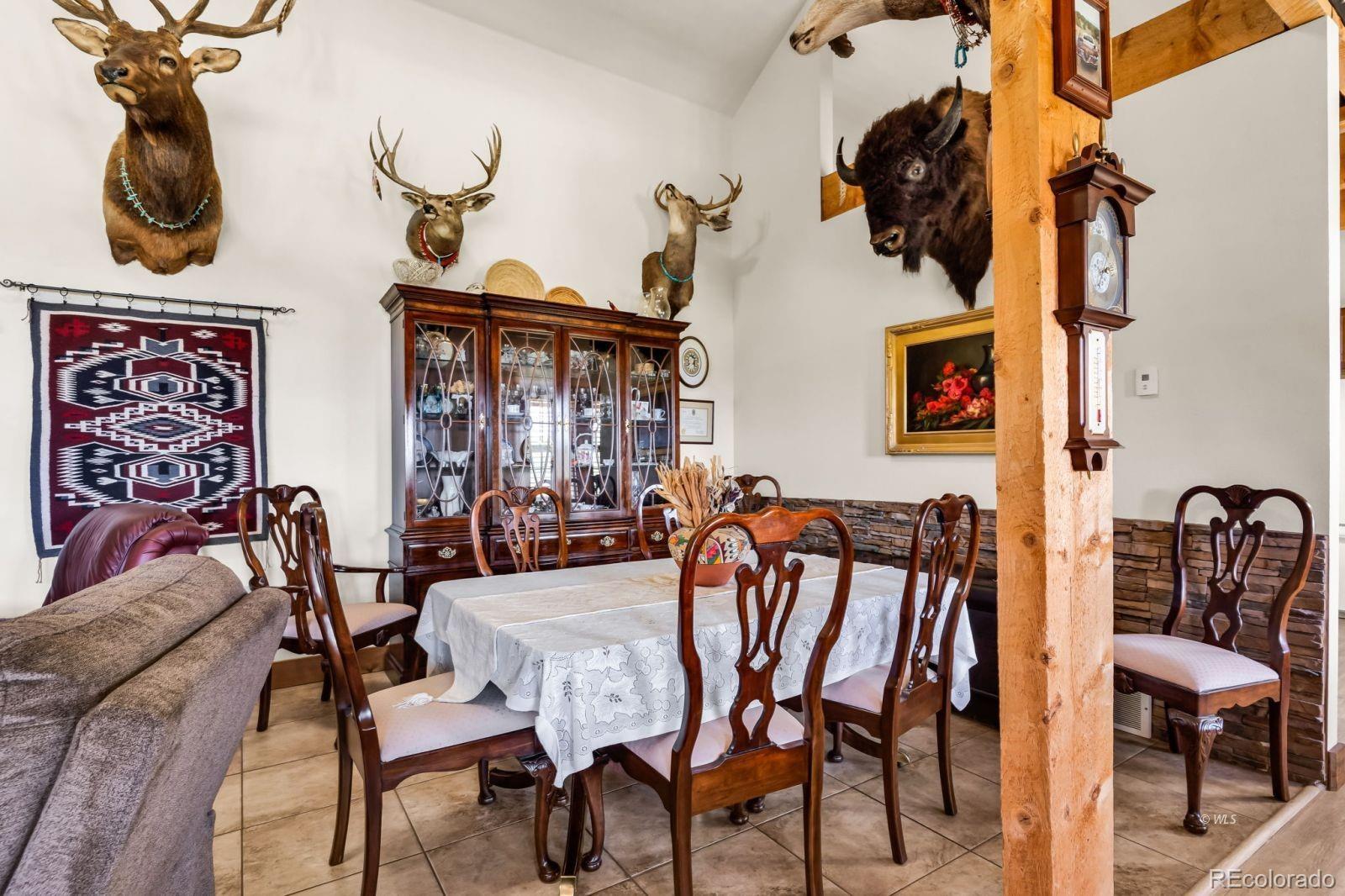 220 Rhonda Road Westcliffe, CO 81252 - Photo 4 of 35 a dining room with furniture and wooden floor