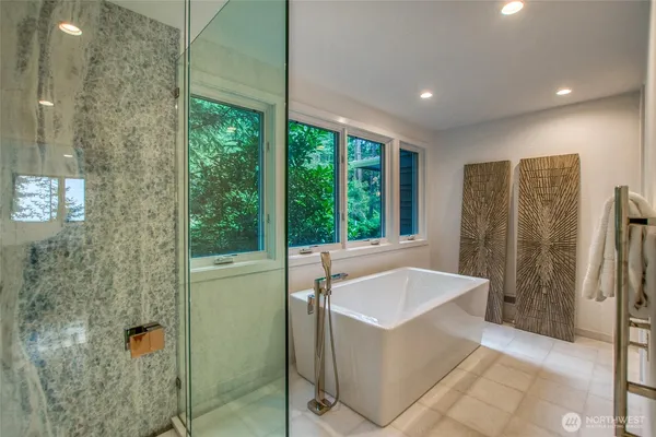 a bathroom with a tub and sink