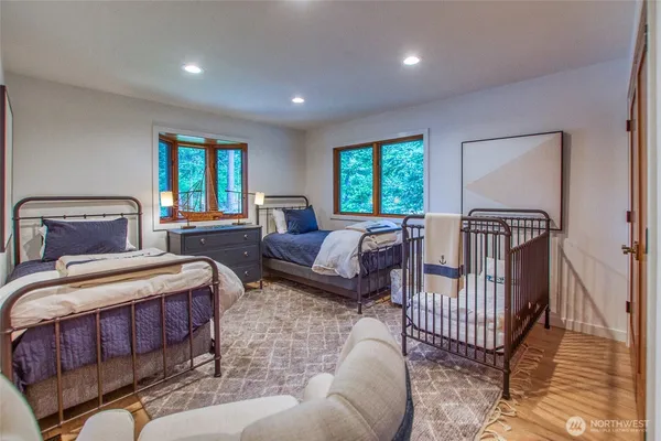 a bedroom with furniture and a window