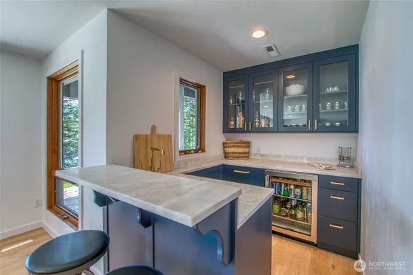 a kitchen with a stove a sink and a refrigerator