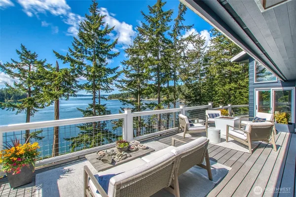 a view of balcony with furniture and garden