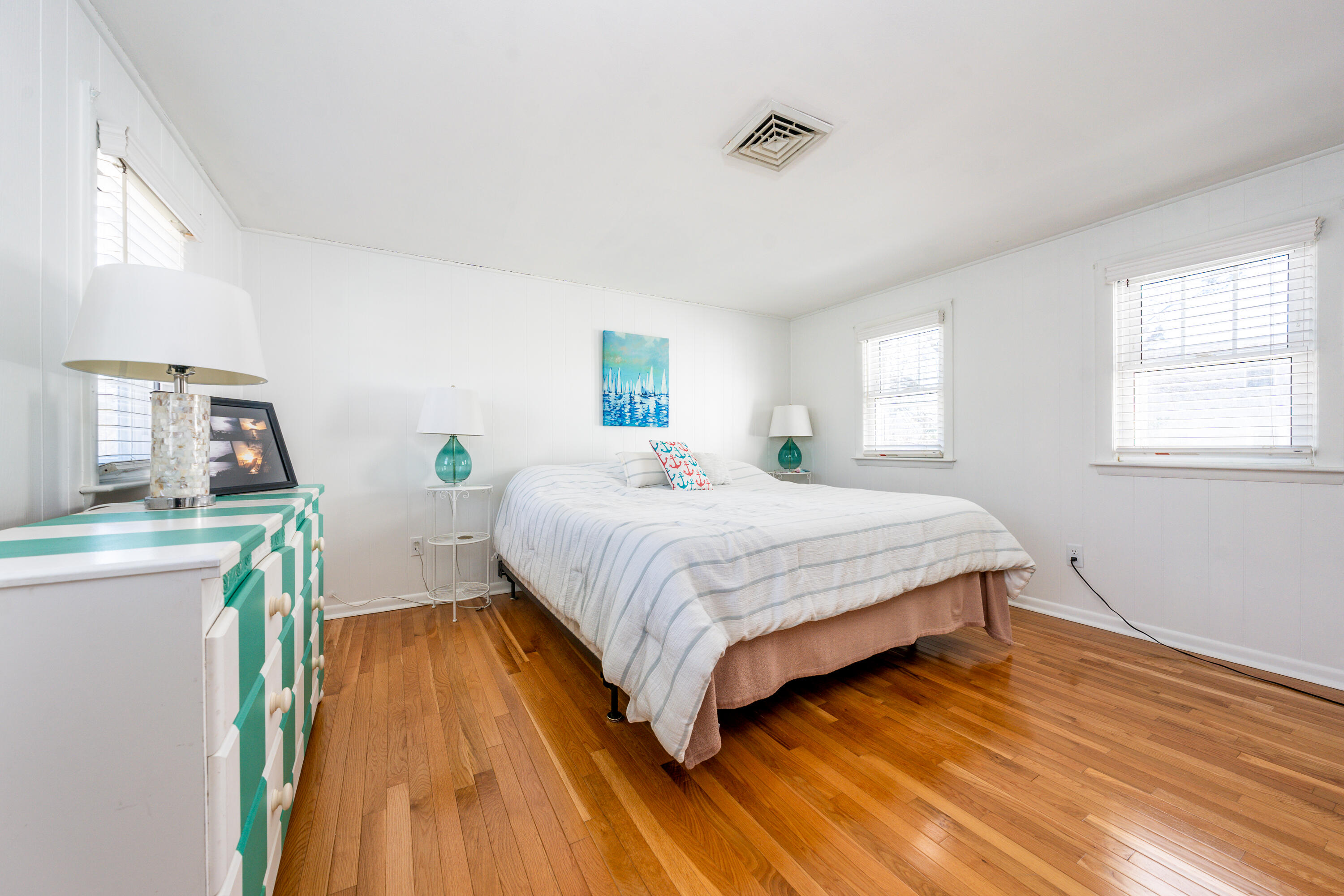 121 Sixth Avenue West Hyannisport, MA 02672 - Photo 13 of 35 a bedroom with a bed windows and wooden floor