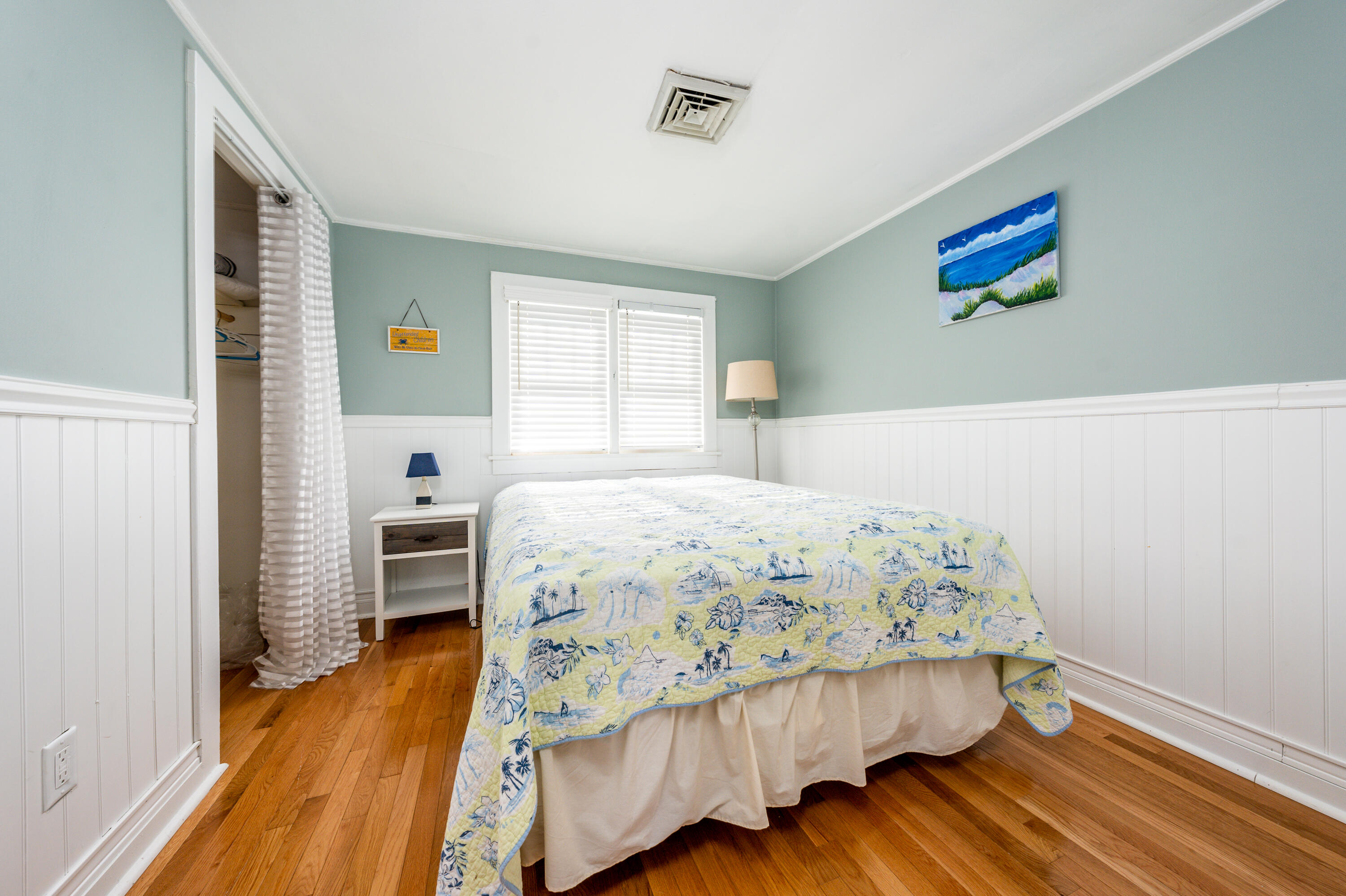 121 Sixth Avenue West Hyannisport, MA 02672 - Photo 15 of 35 a bedroom with a bed and wooden floor