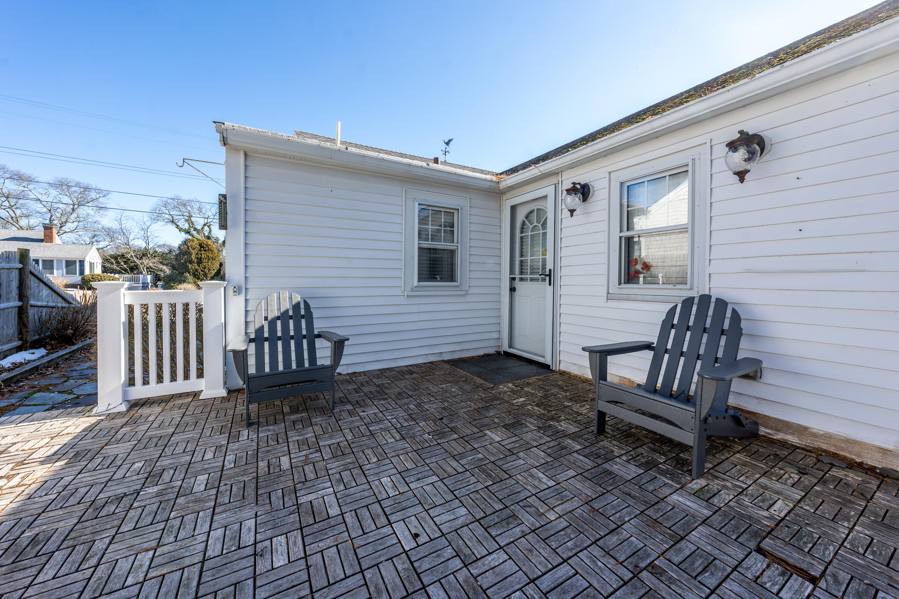 121 Sixth Avenue West Hyannisport, MA 02672 - Photo 20 of 35 a view of a wooden chairs and bench in the backyard