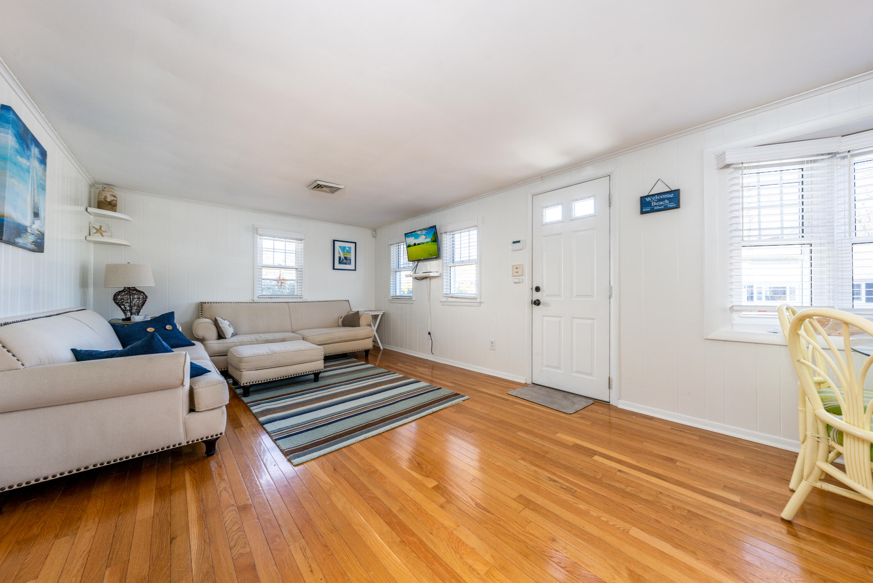 121 Sixth Avenue West Hyannisport, MA 02672 - Photo 6 of 35 a spacious bedroom with a bed and wooden floor
