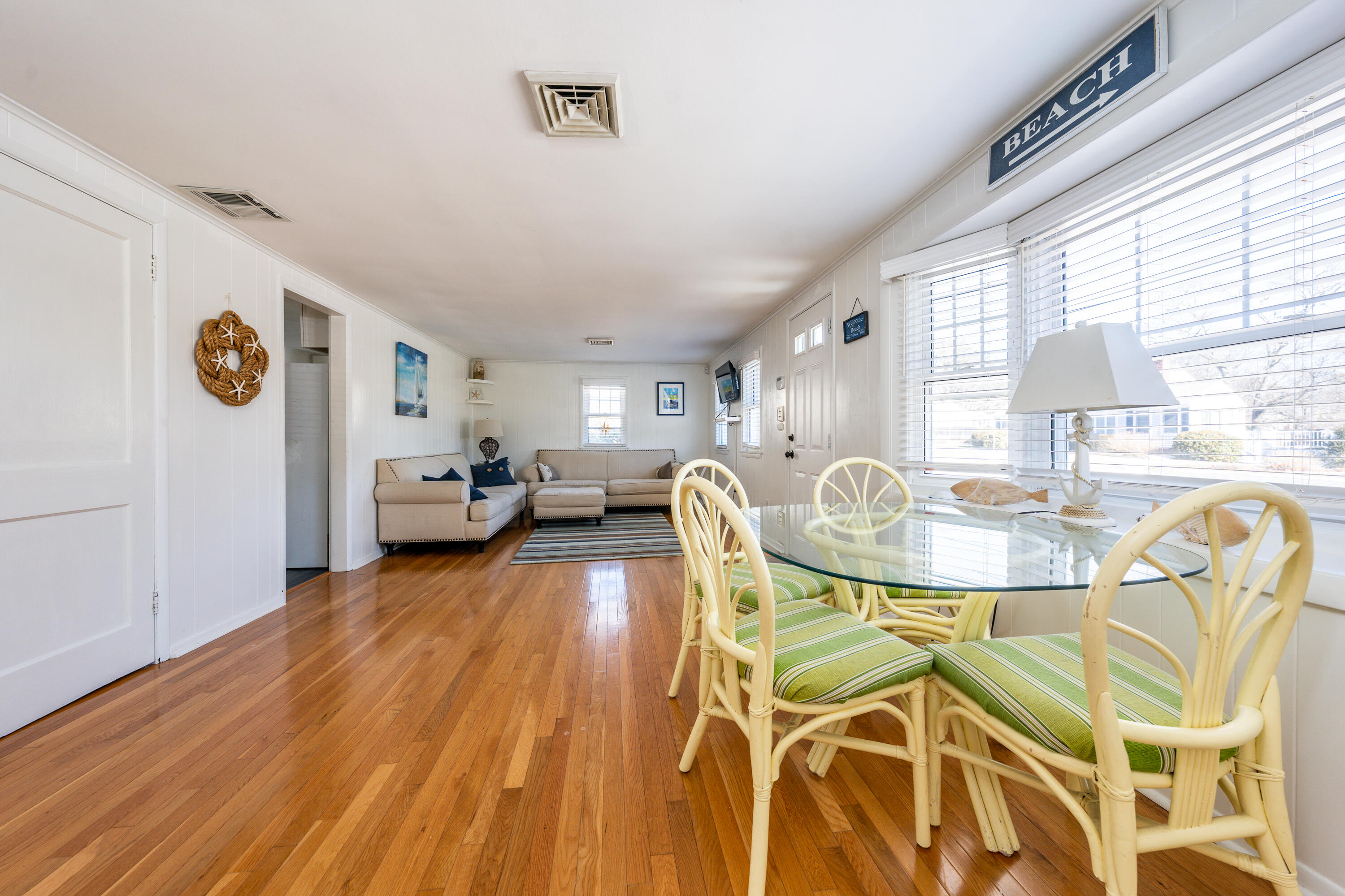 121 Sixth Avenue West Hyannisport, MA 02672 - Photo 7 of 35 a view of a dining room with furniture and wooden floor