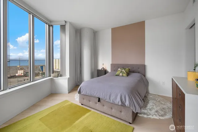 a bedroom with a bed and a dresser