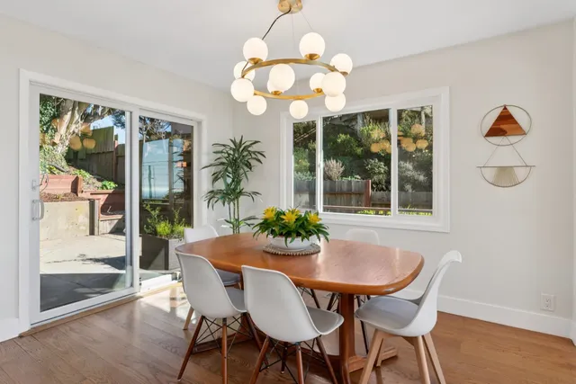 a dining room with furniture and window