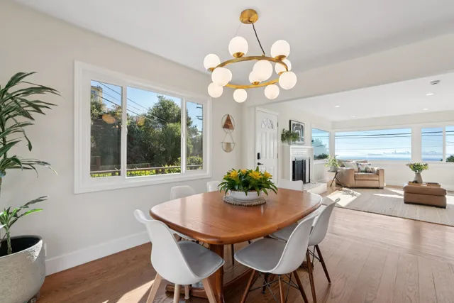 a view of a dining room with furniture window and outside view